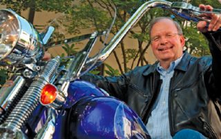 Chuck Toeniskoetter on Motorcycle